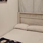 Couples Room With Window Smart Tv Fridge