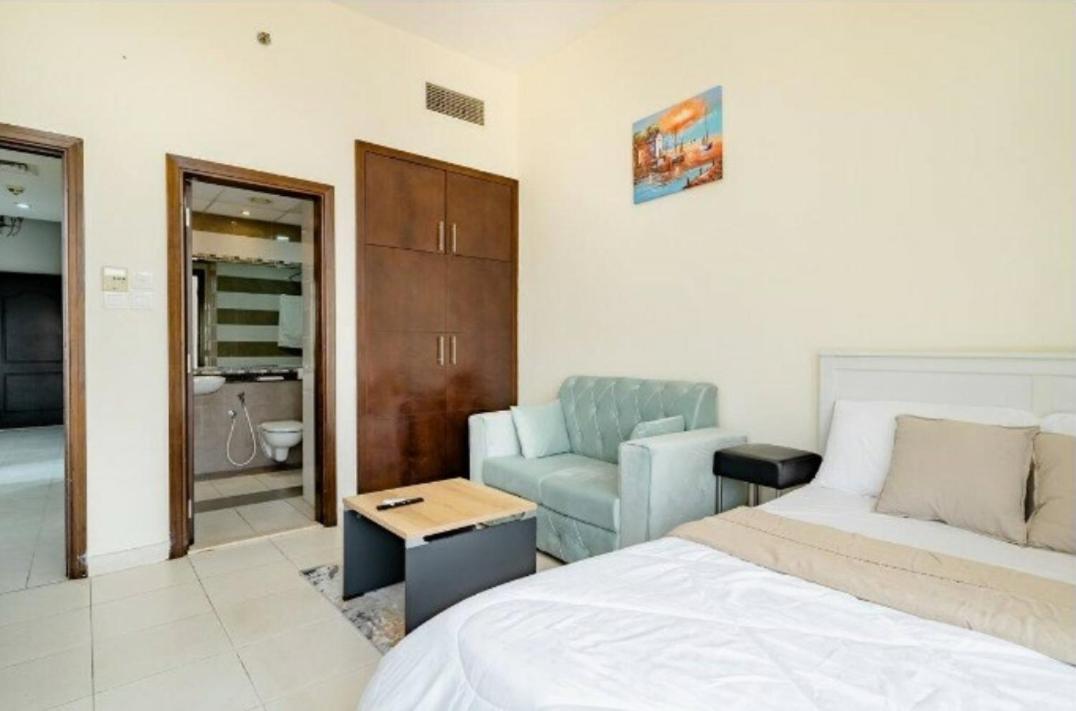 Serene Masters Bedroom With Balcony & Shared Kitchen Apartment Dubai