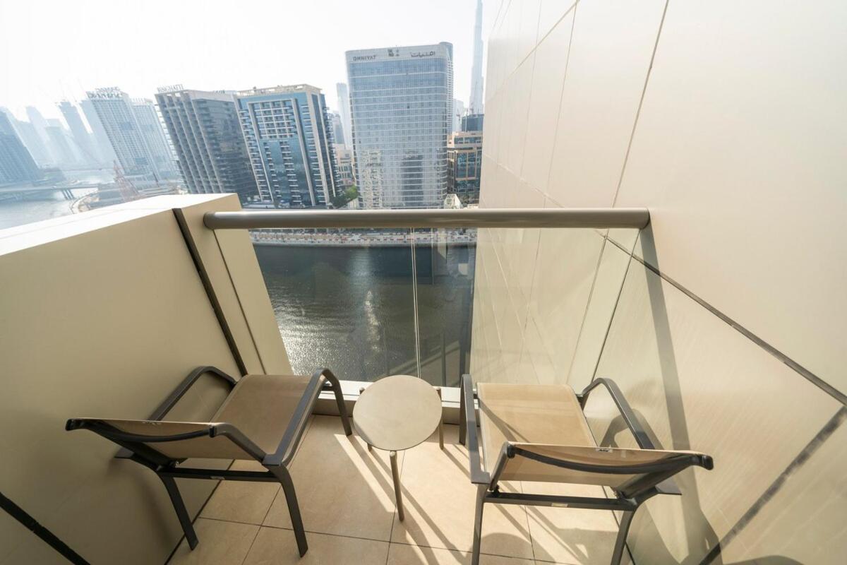 5 Star 2br W & Infinity Pool Full Canal & Burj Views Apartment Dubai